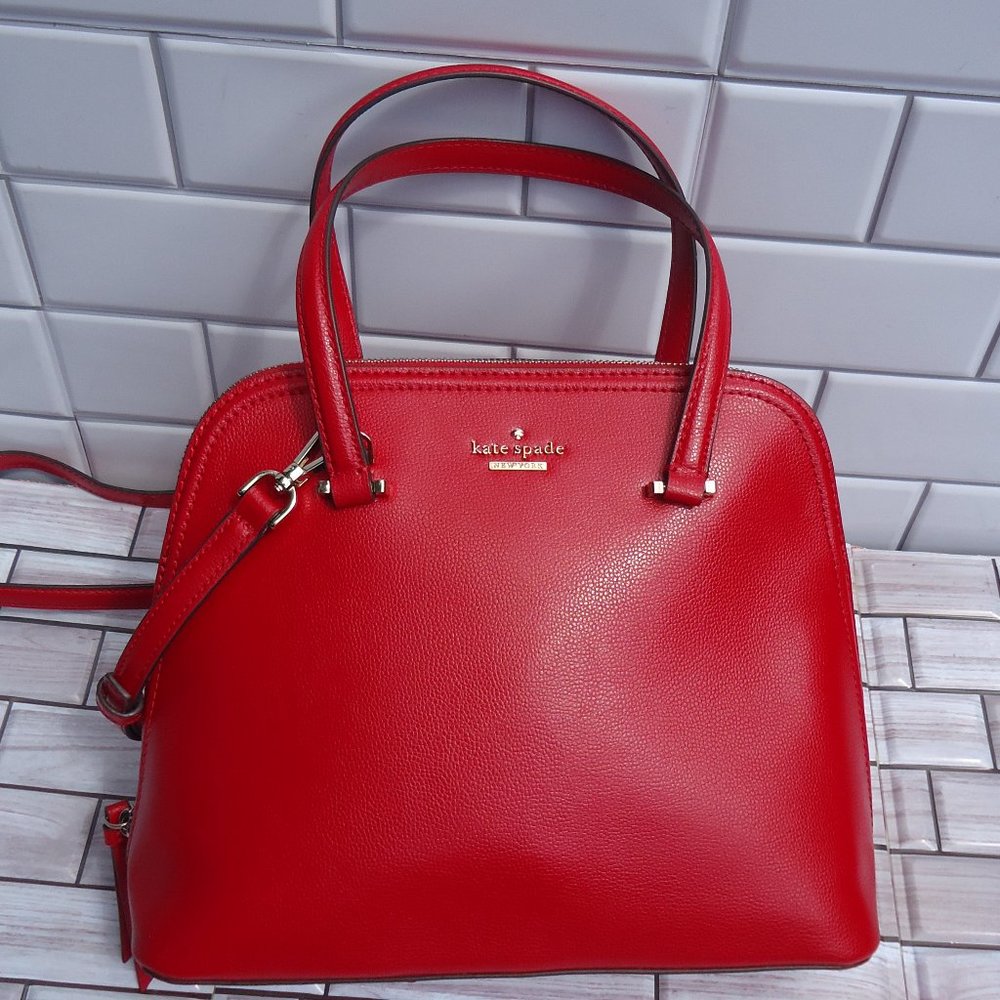 Kate Spade New York red leather, zip around satchel purse.